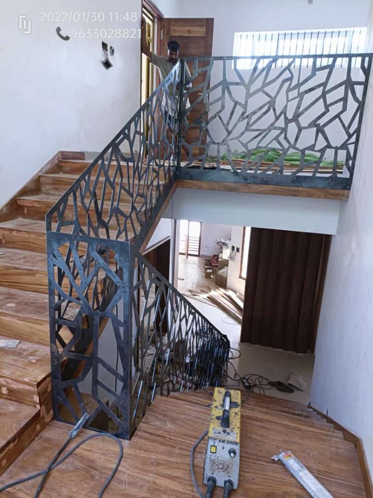 Staircase handrail with laser-cut branch pattern