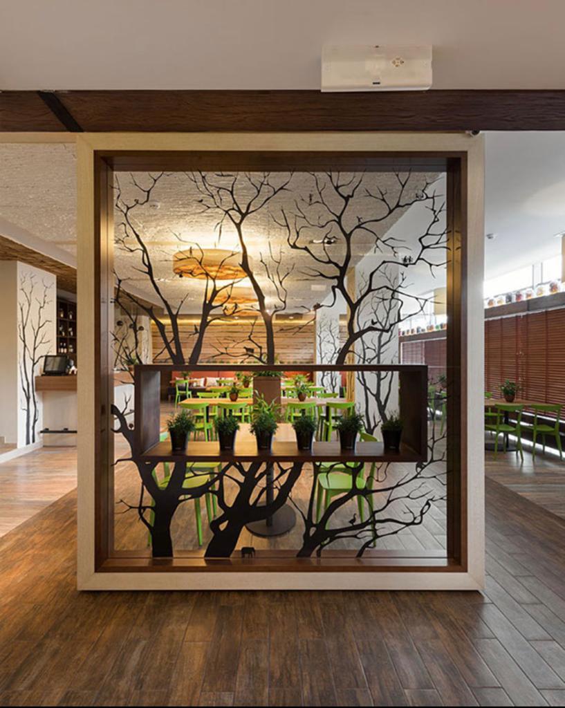 Tree pattern partition with planter shelf in a home